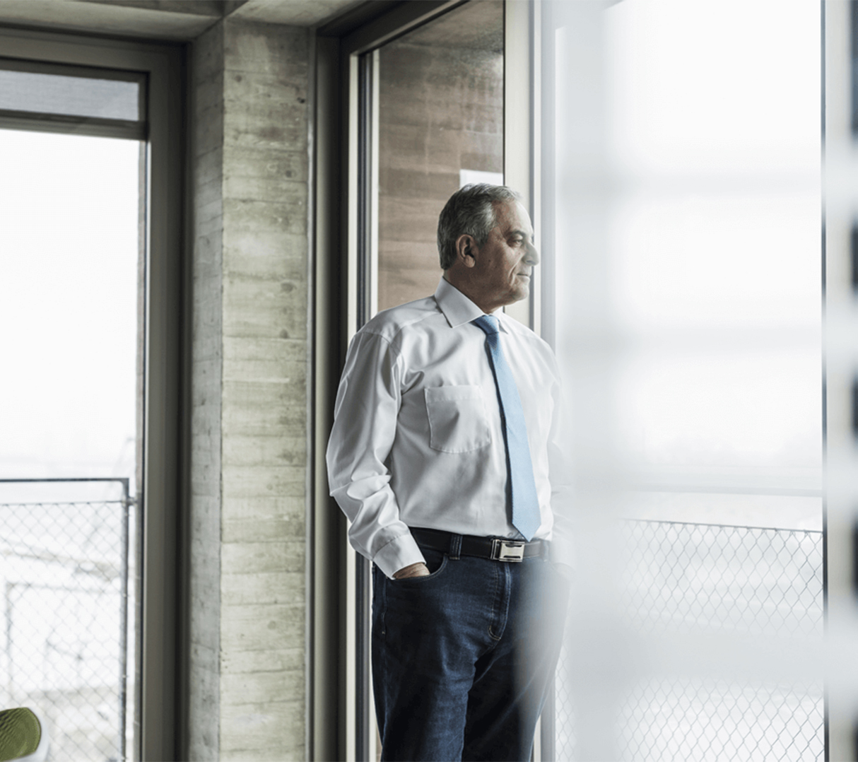 man in front of window man in front of window